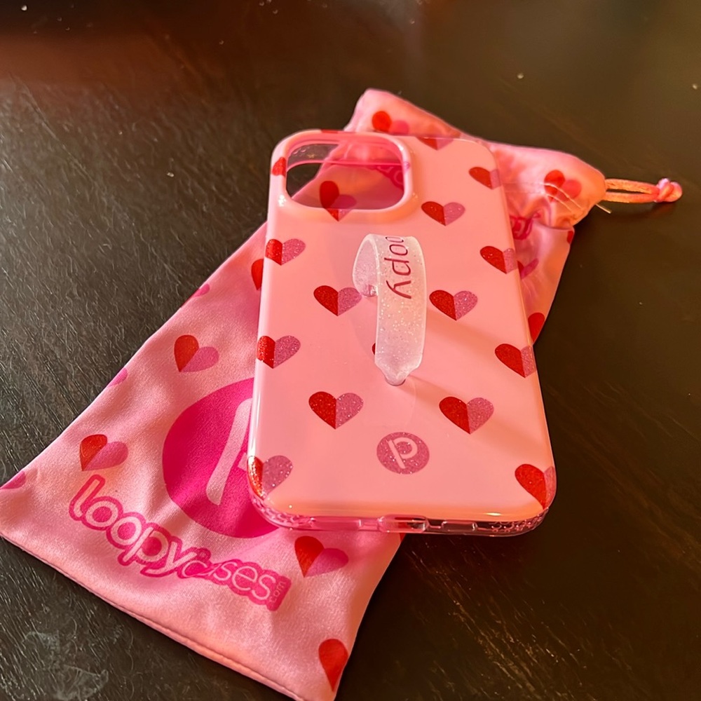 Never used pink heart loopy case 13 pro IPhone.